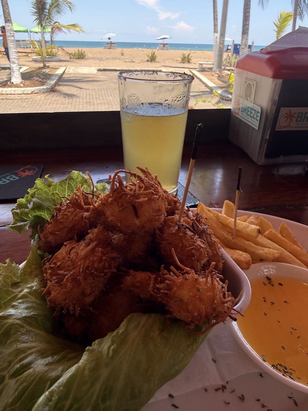 Camarones Breeze with the beach behind — Breeze, a beachfront restaurant in Jacó